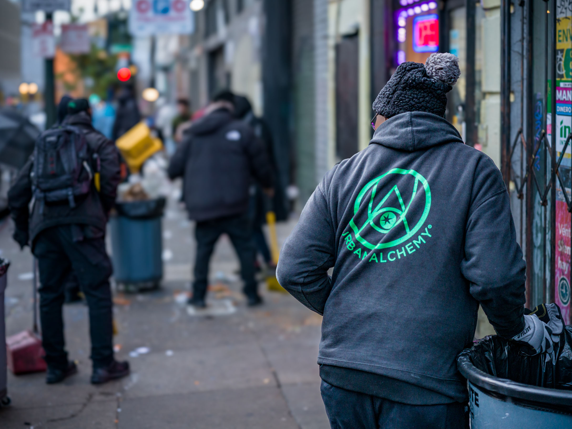 Urban Alchemy Practitioner Cleaning Street